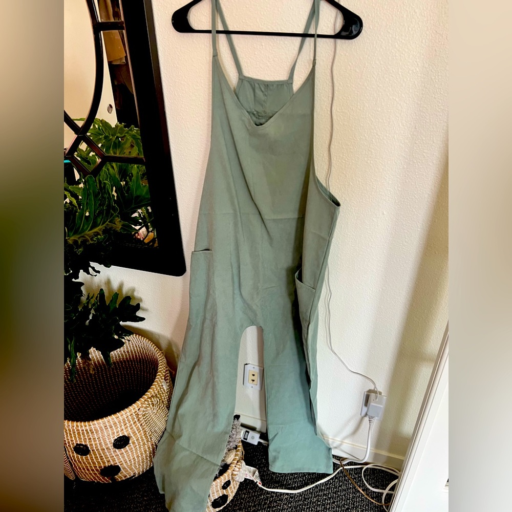 Brand new never worn size small cover alls green jumper